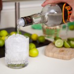 Adding Cachaça over ice Adding Cachaça over ice