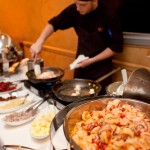 Shrimp and Grits being cooked with all of the components involved