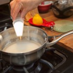 Heat the water to a boil, then turn to medium. Add sugar. Heat the water to a boil, then turn to medium. Add sugar.