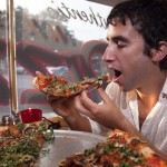 Seth eating some pizza
